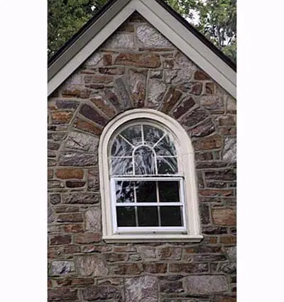 A building with a storm window.