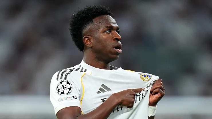 Vinicius Jr., Tchouameni lead Real Madrid past Benfica 2-1 to reach Champions League Round of 16 in controversial series