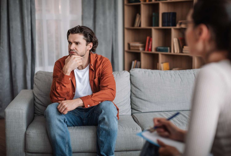 Young man talking to a therapist