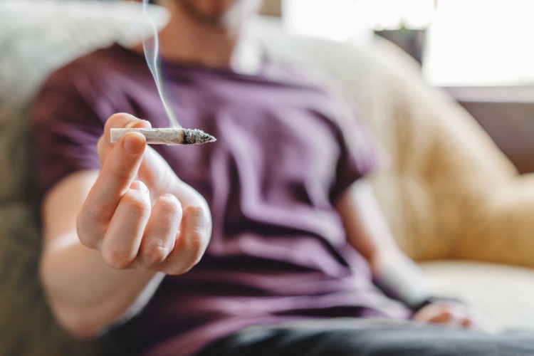 Man holding a joint