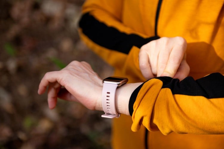 adult woman checking smart watch