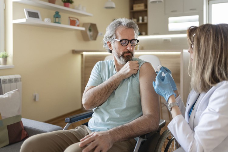 male patient receiving vaccine