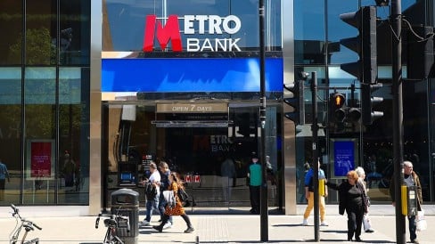 People walk outside a Metro Bank branch