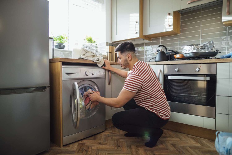 man doing laundry