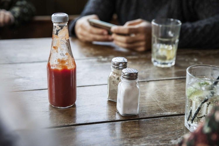 Salt and pepper shaker on table 