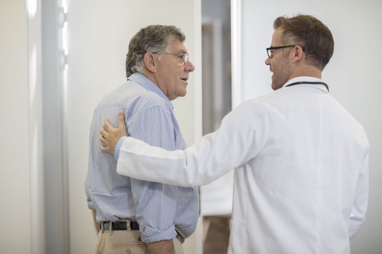 Doctor talking to older man