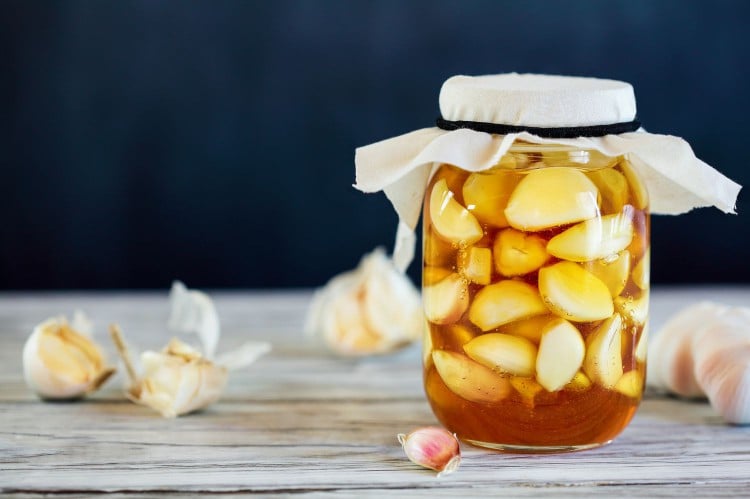 Garlic cloves in honey jar