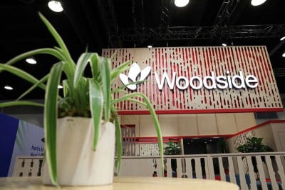 Woodside says Santos merger talks still at early stage as it forecasts higher production